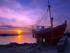 15_The-famous-red-boat-of-Mykonos-at-sunset.-Greece.
