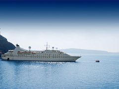 35_luxury-white-cruise-ship-on-a-clear-day-with-calm-seas-and-blue-sky-on-the-greek-island-of-santorini